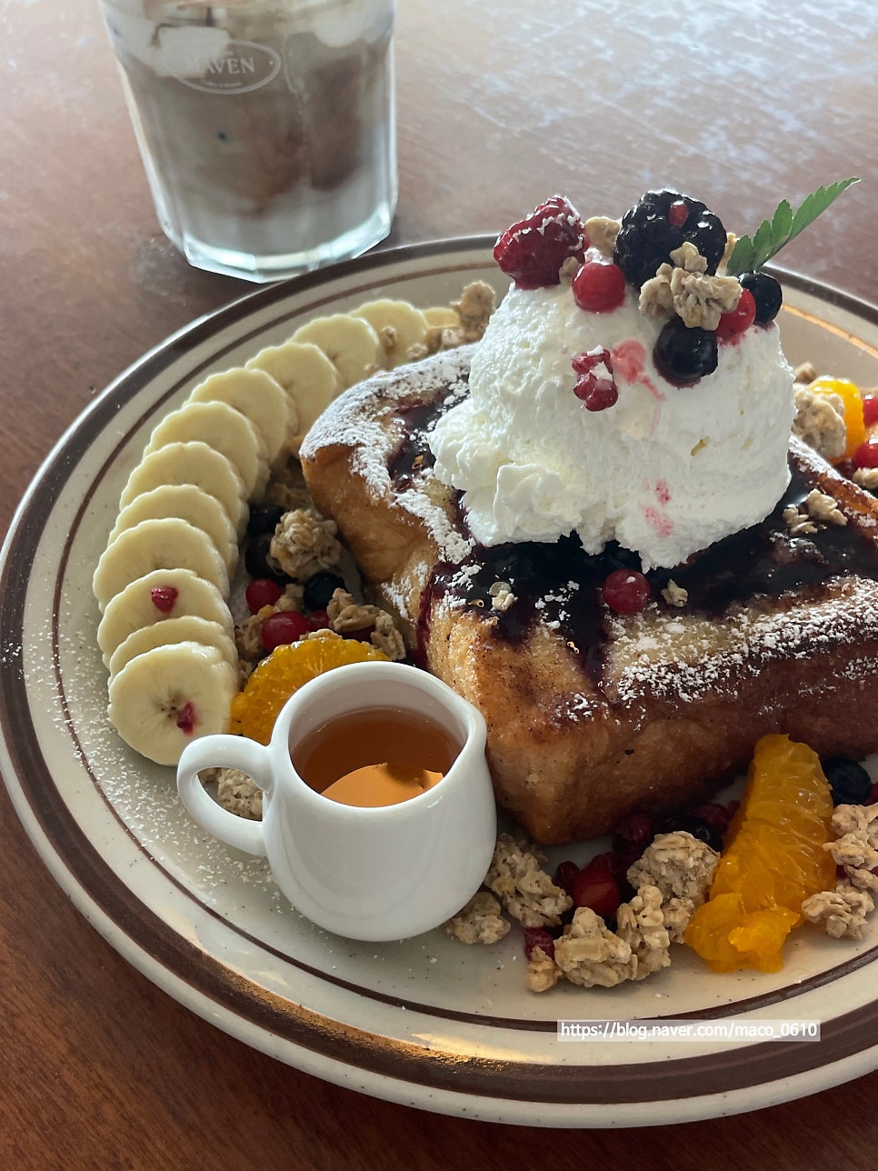 Mascarpone French toast topped with cream, berries and fruit